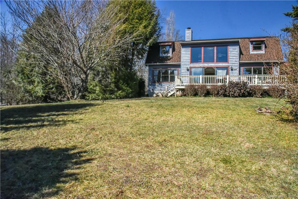 286 Pioneer Ridge Road Canton, NC 28716 - Photo 11 of 33 a front view of a house with a yard table and chairs