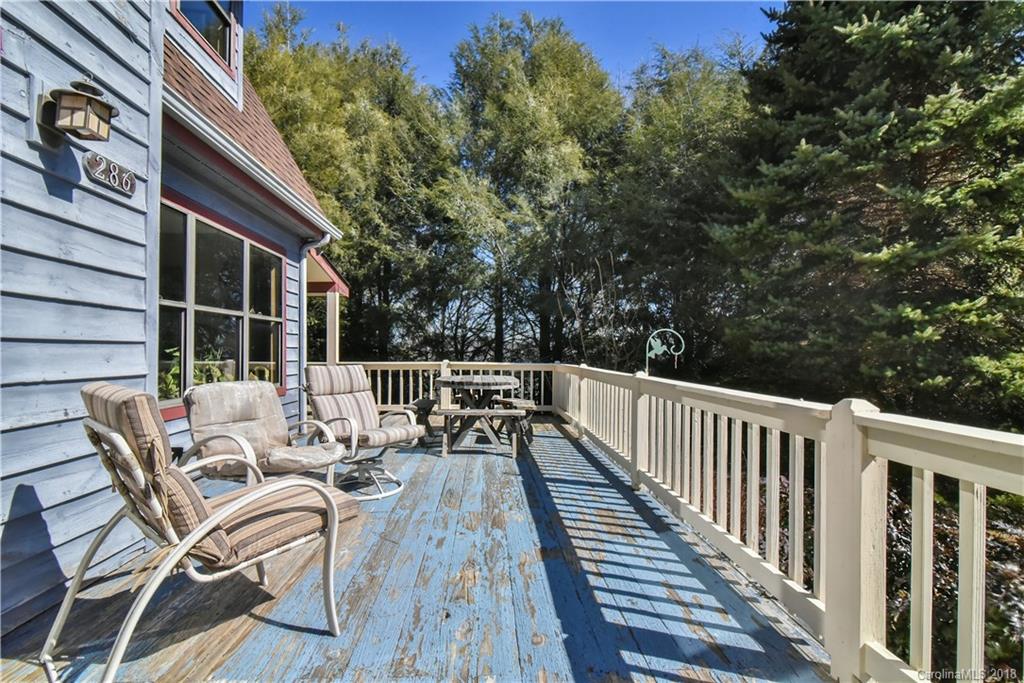 286 Pioneer Ridge Road Canton, NC 28716 - Photo 15 of 33 a view of balcony with wooden floor and outdoor seating
