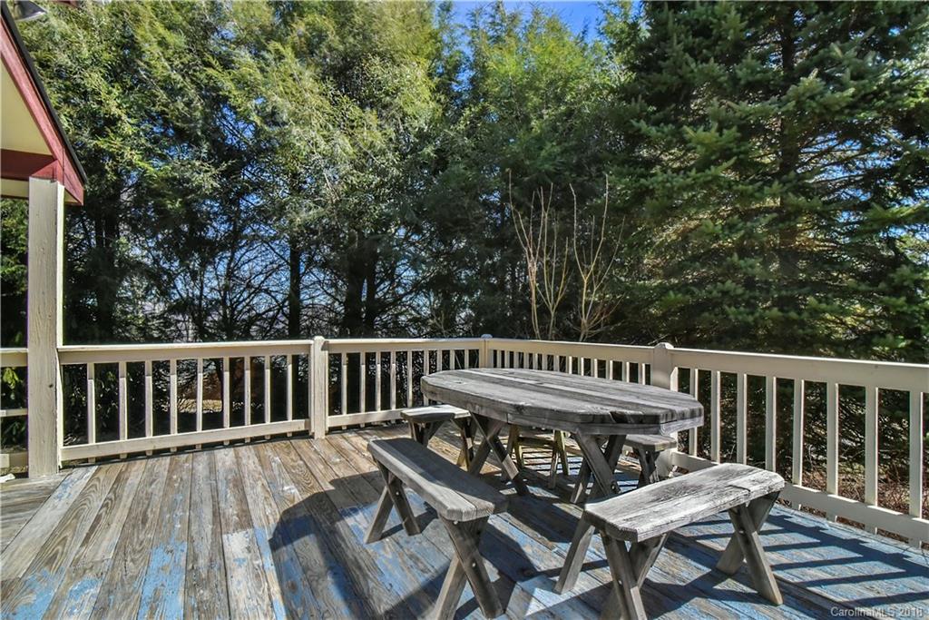 286 Pioneer Ridge Road Canton, NC 28716 - Photo 16 of 33 a view of a wooden deck with furniture