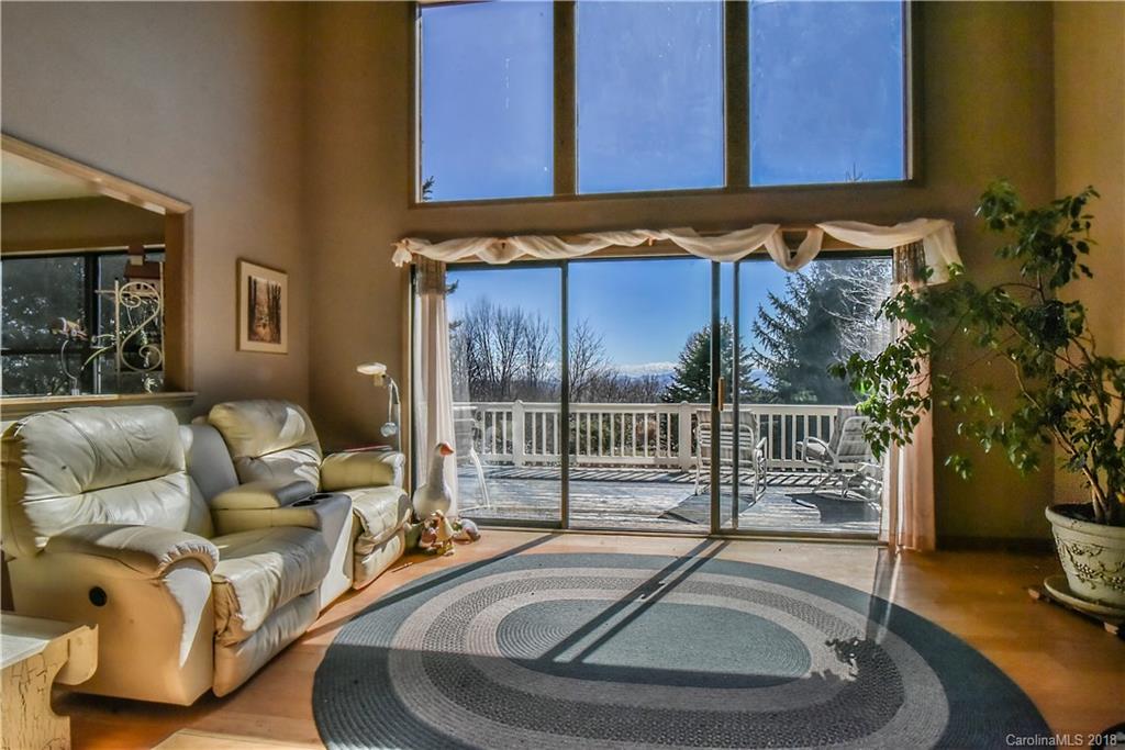 286 Pioneer Ridge Road Canton, NC 28716 - Photo 18 of 33 a view of a livingroom with furniture and floor to ceiling window