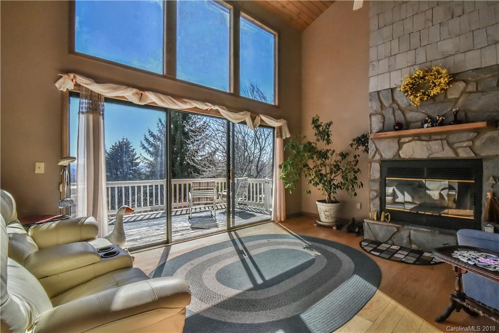 286 Pioneer Ridge Road Canton, NC 28716 - Photo 19 of 33 a living room with furniture and a fireplace