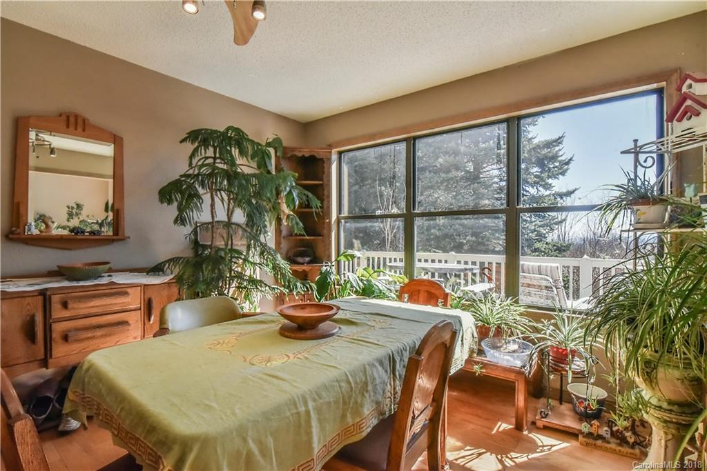 286 Pioneer Ridge Road Canton, NC 28716 - Photo 20 of 33 a view of a dining room with furniture window and outside view
