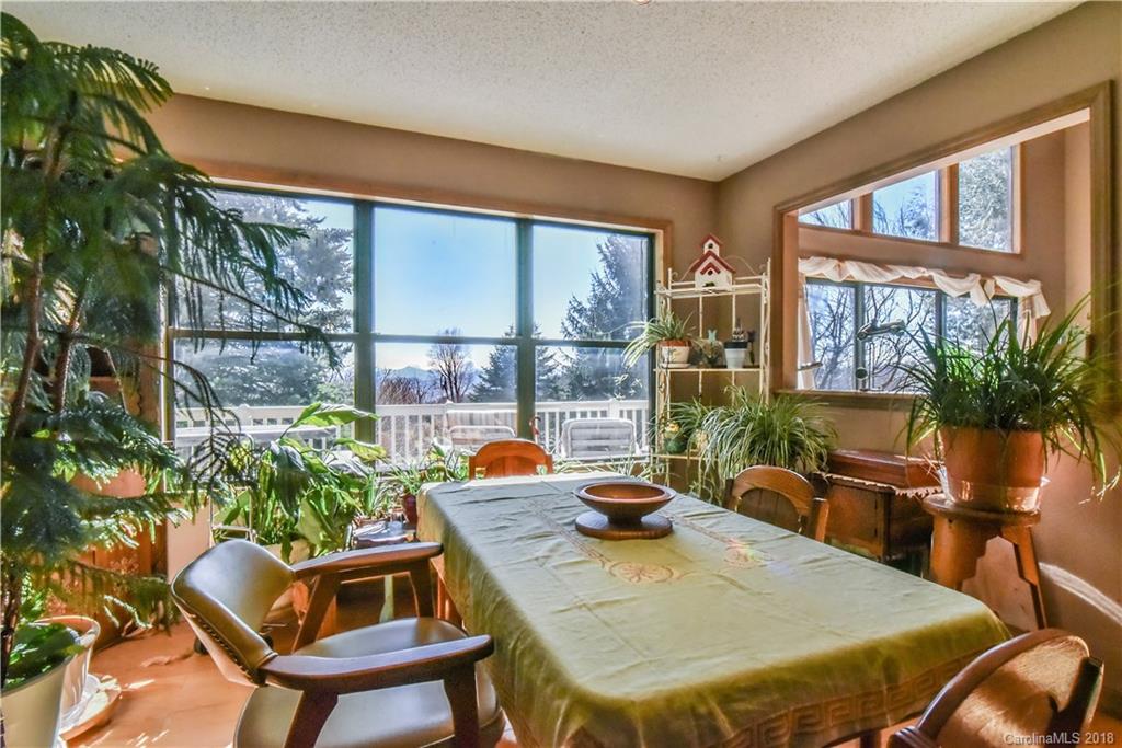 286 Pioneer Ridge Road Canton, NC 28716 - Photo 21 of 33 a view of a dining room with furniture window and outside view