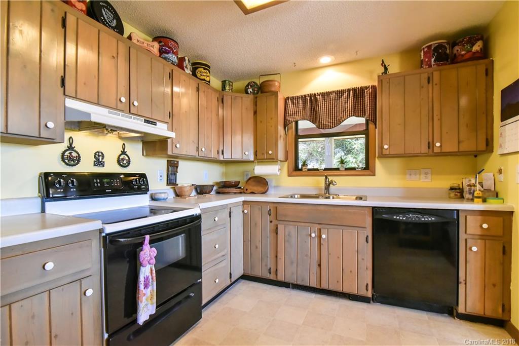 286 Pioneer Ridge Road Canton, NC 28716 - Photo 23 of 33 a kitchen with a sink cabinets and window