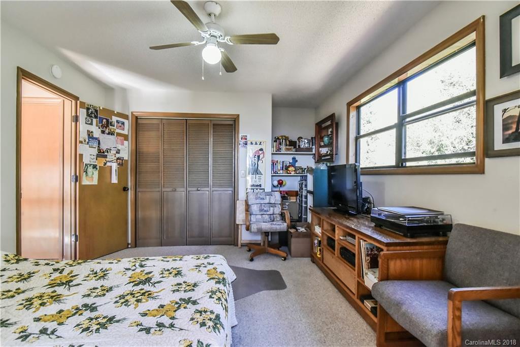 286 Pioneer Ridge Road Canton, NC 28716 - Photo 33 of 33 a bedroom with furniture and a window