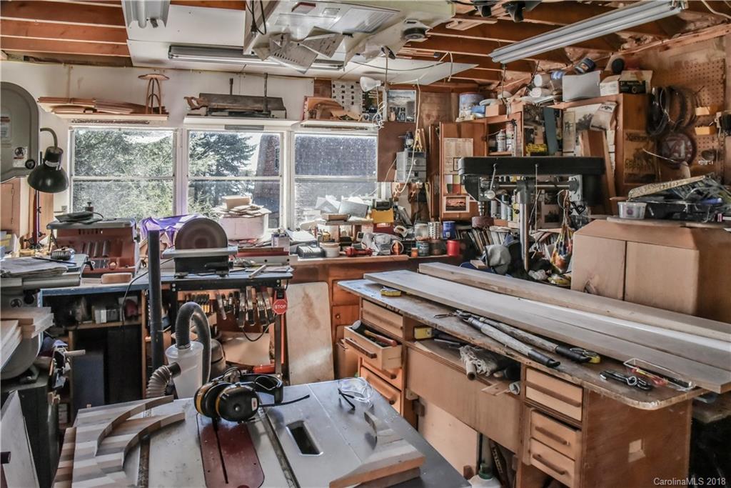 286 Pioneer Ridge Road Canton, NC 28716 - Photo 8 of 33 a view of a kitchen with furniture and a grill