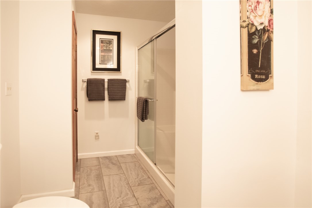 200 Chenault Road Townville, SC 29689 - Photo 25 of 47 A well-appointed bathroom features a glass-enclosed shower and durable tile flooring.