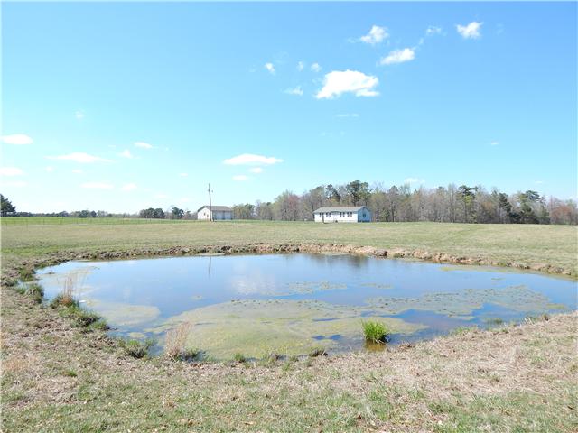 25517 Sweet Springs Road Elkmont, AL 35620 - Photo 14 of 18 a view of a lake with a big yard