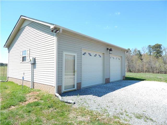 25517 Sweet Springs Road Elkmont, AL 35620 - Photo 3 of 18 a view of a backyard with wooden fence