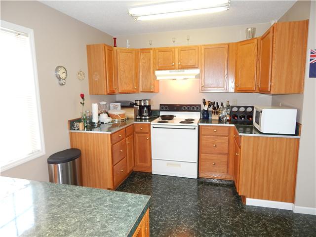 25517 Sweet Springs Road Elkmont, AL 35620 - Photo 5 of 18 a kitchen with sink a cabinets and window