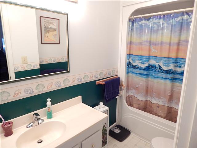 25517 Sweet Springs Road Elkmont, AL 35620 - Photo 10 of 18 a bathroom with a sink and a mirror