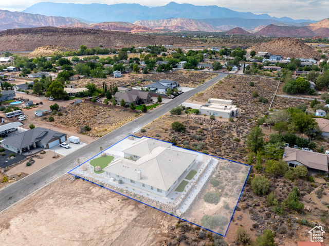 230 Boulder Way Leeds, UT 84746 - Photo 66 of 72 Aerial view of residential area with property parcel outlined and a mountain backdrop