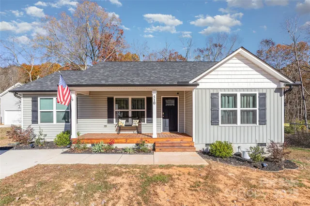 front view of a house with a yard