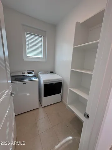 a utility room with washer and dryer