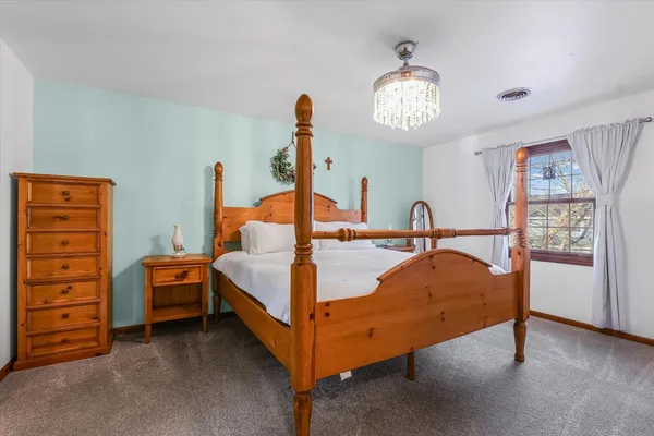 a bed room with a bed and a window