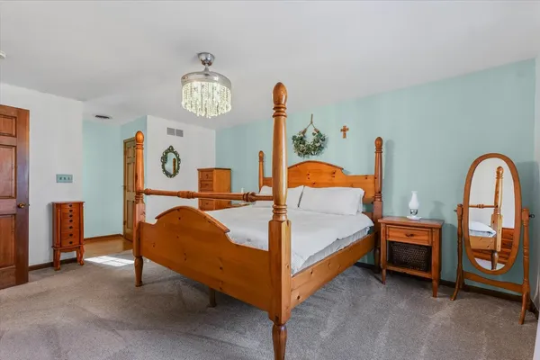 a bed room with a bed and a large window