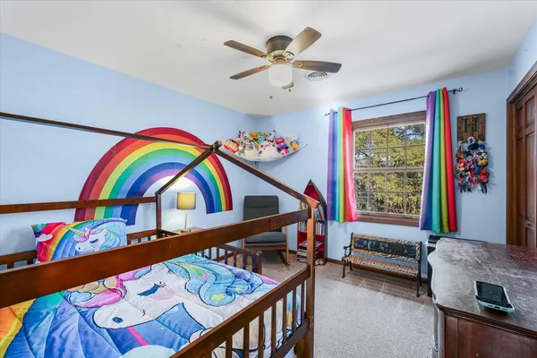 a bedroom with furniture and a bed