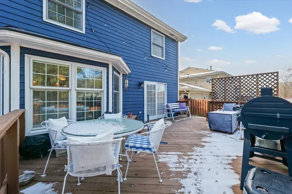 a view of a patio with table and chairs