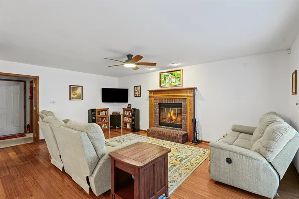 a living room with furniture and a fireplace