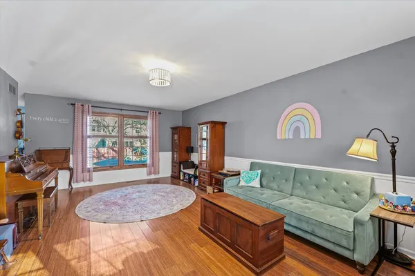 a living room with furniture and a window