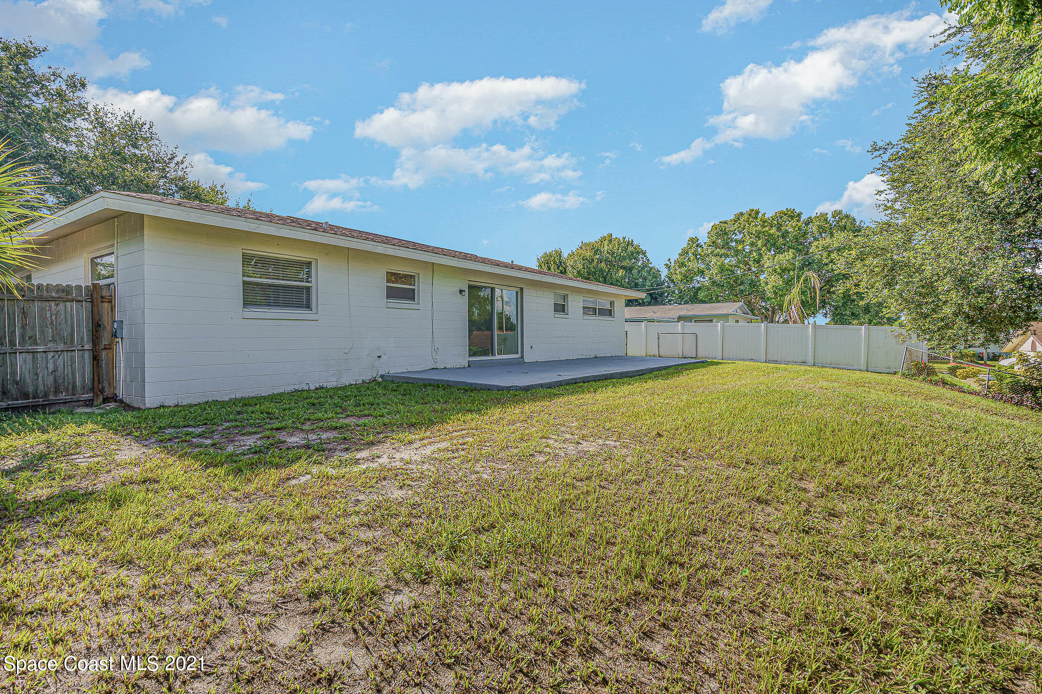 1120 North Carpenter Road Titusville, FL 32796 - Photo 20 of 22 a view of an house with backyard and garden