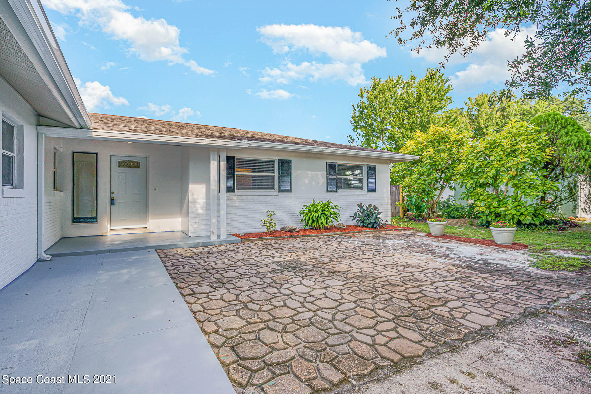 1120 North Carpenter Road Titusville, FL 32796 - Photo 3 of 22 a view of a house with a yard
