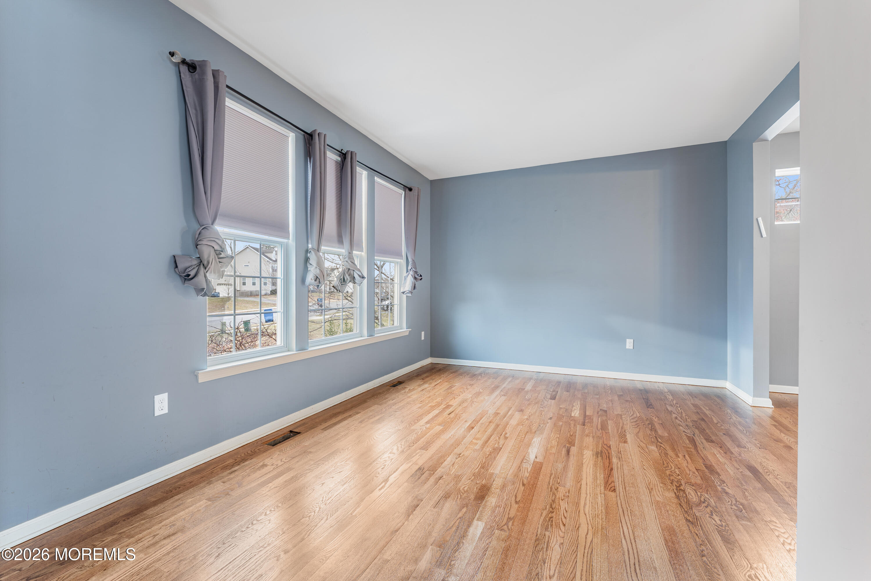 44 Imperial Place North Jackson, NJ 08527 - Photo 11 of 38 a view of an empty room with wooden floor and a window