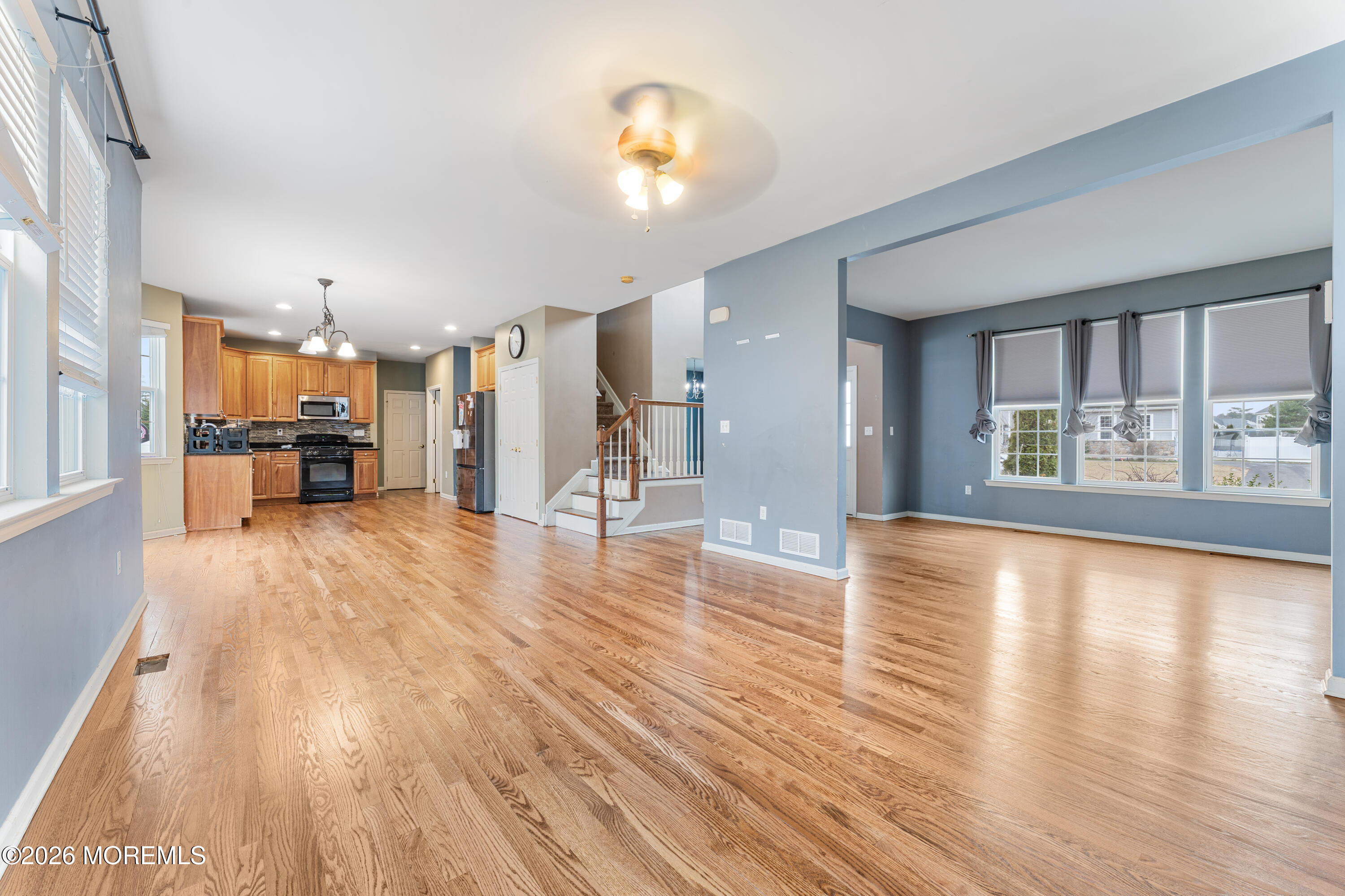 44 Imperial Place North Jackson, NJ 08527 - Photo 13 of 38 a view of a livingroom with furniture hardwood floor and a kitchen