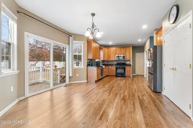 a view of a kitchen with a sink and microwave