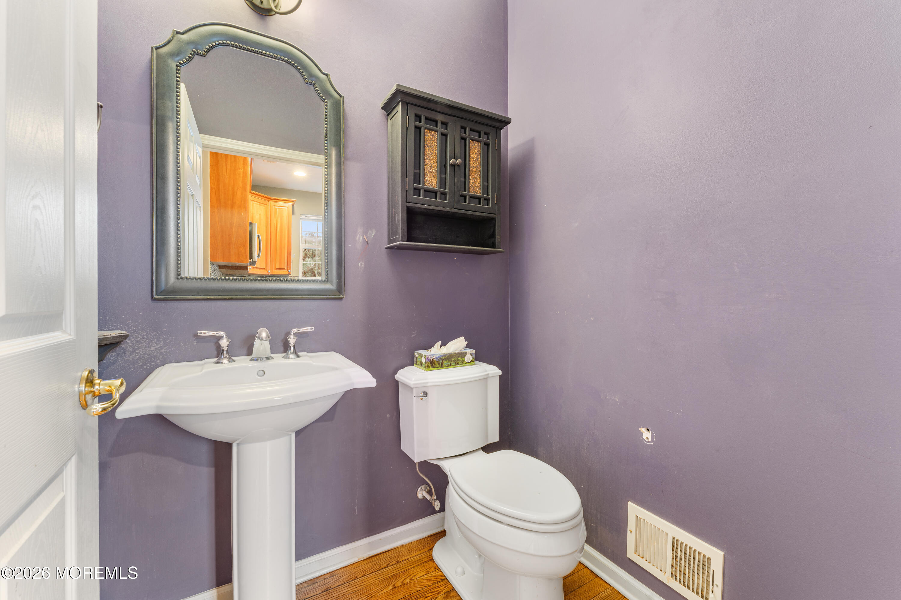 44 Imperial Place North Jackson, NJ 08527 - Photo 16 of 38 a bathroom with a toilet sink and mirror