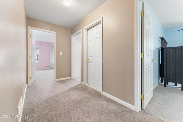 a view of a hallway with closet area