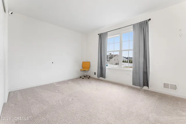a view of a room with window and a kitchen