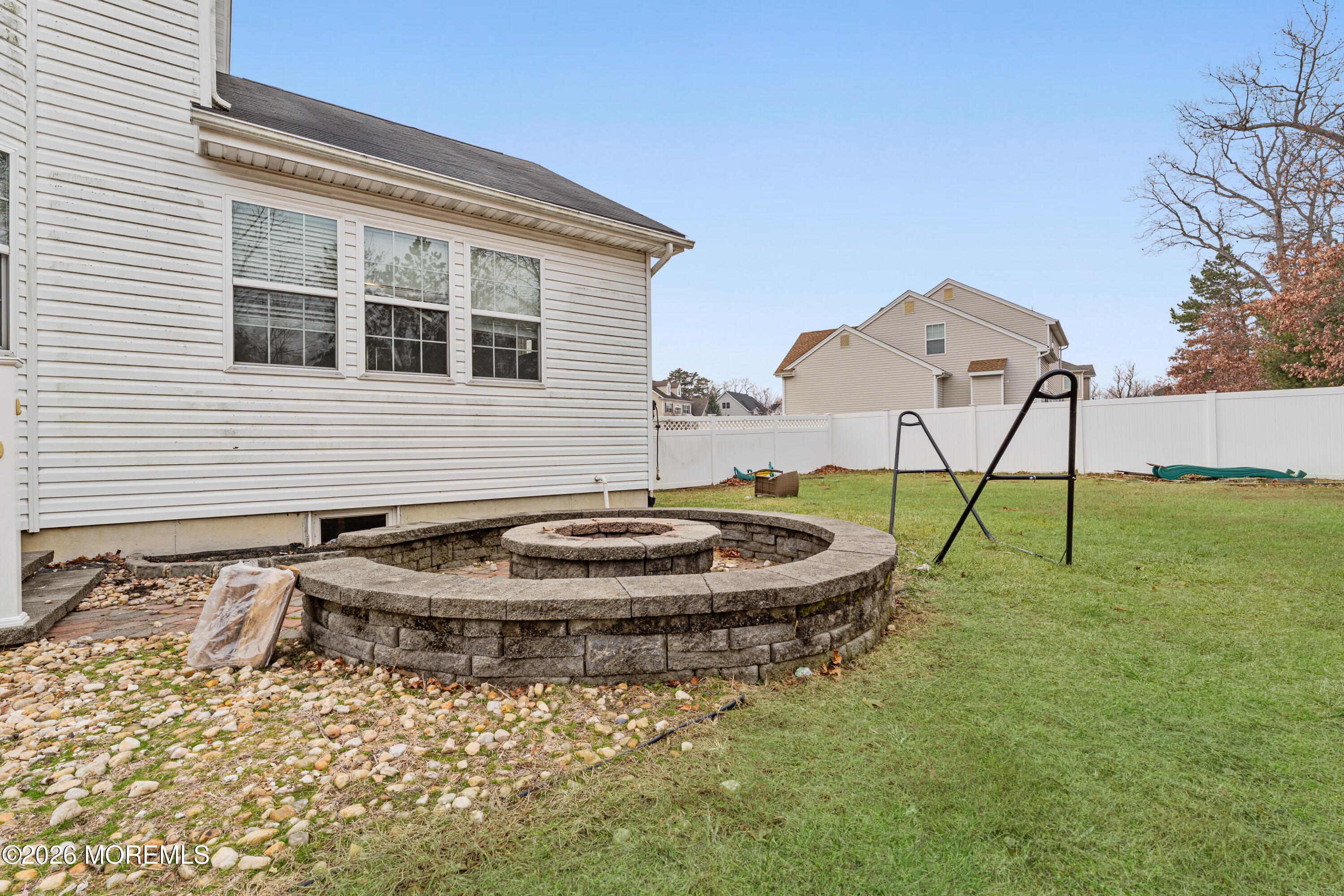 44 Imperial Place North Jackson, NJ 08527 - Photo 27 of 38 a backyard of a house with table and chairs