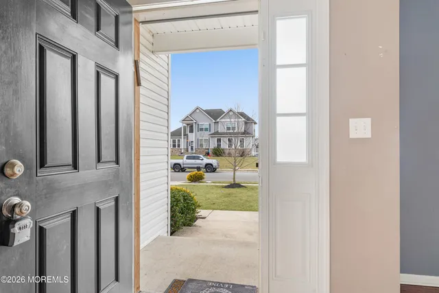 a view of livingroom with furniture and front door
