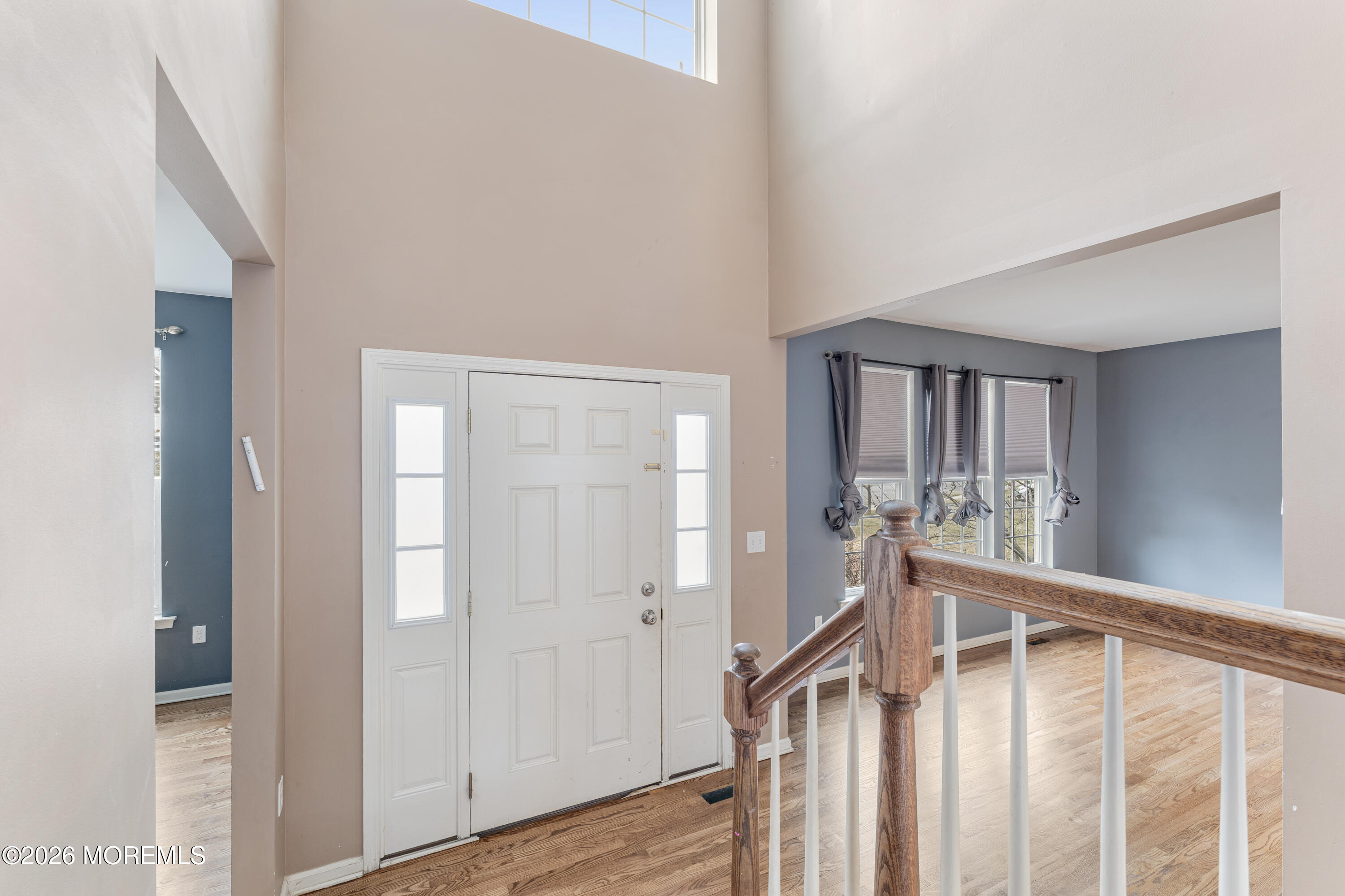 44 Imperial Place North Jackson, NJ 08527 - Photo 6 of 38 a view of a hallway with wooden floor and stairs