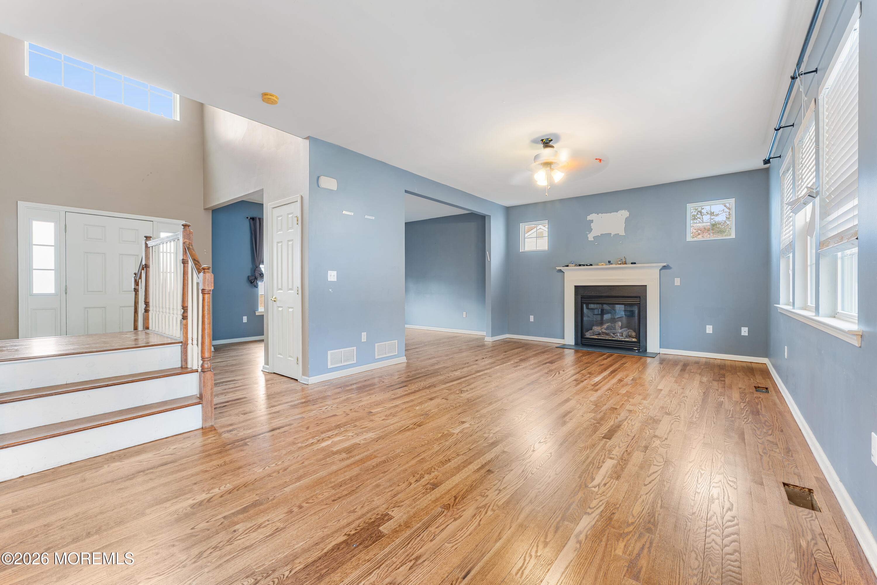 44 Imperial Place North Jackson, NJ 08527 - Photo 8 of 38 a view of empty room with wooden floor and fireplace