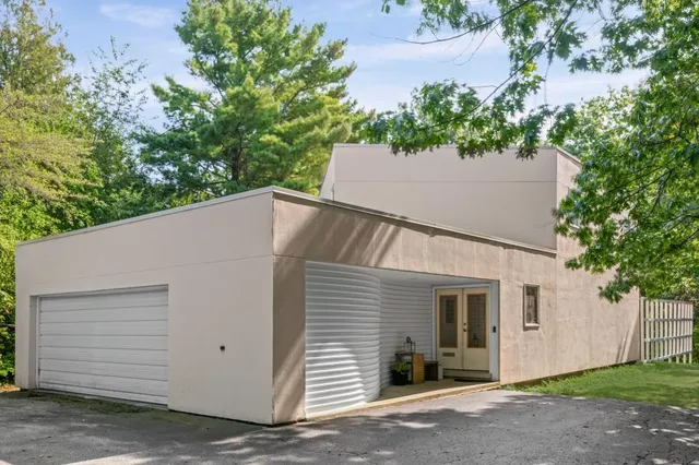 a house with trees in the background