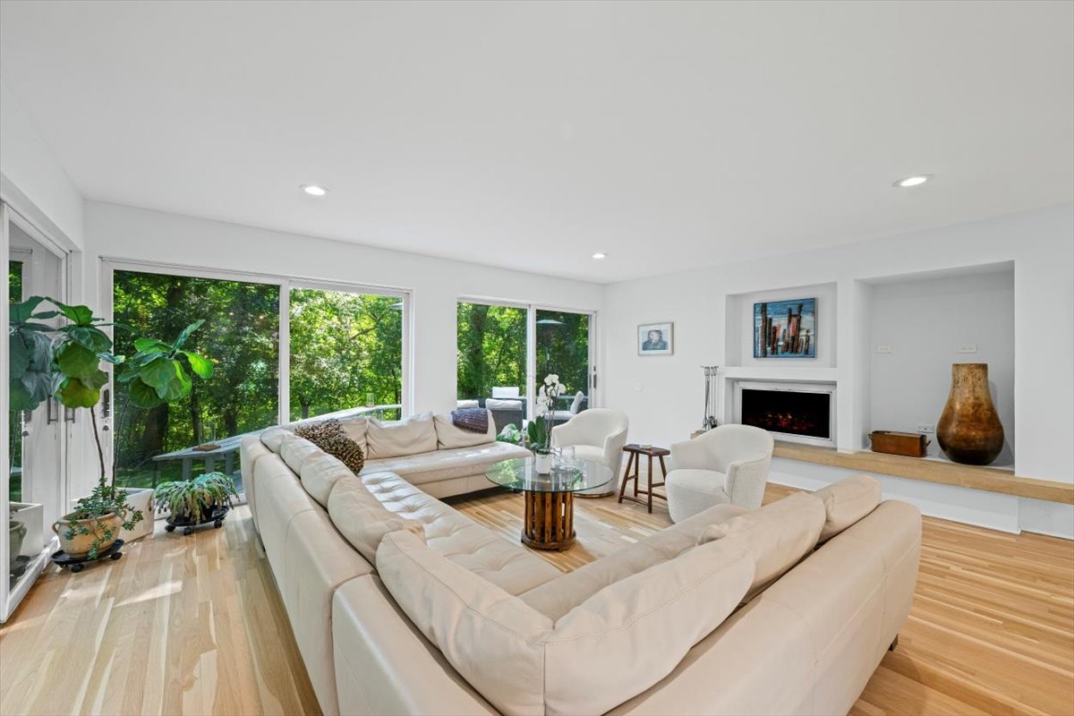 625 Sheridan Road Highland Park, IL 60035 - Photo 11 of 26 a living room with fireplace furniture and a large window