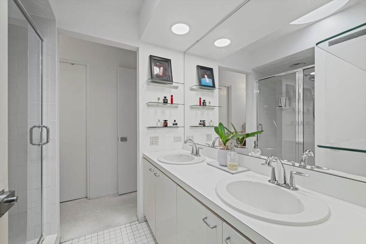 625 Sheridan Road Highland Park, IL 60035 - Photo 19 of 26 a bathroom with a double vanity sink mirror and