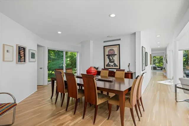 a view of a dining room with furniture and wooden floor