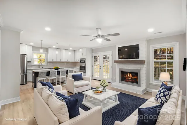 a living room with furniture fireplace and a flat screen tv
