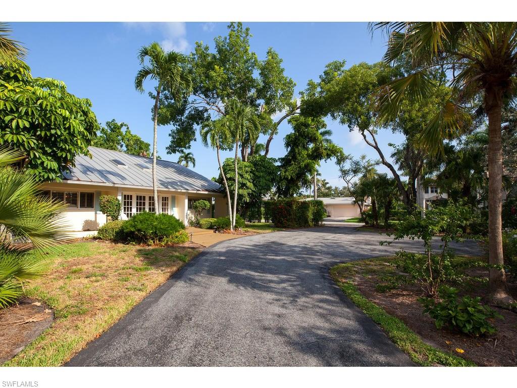 641 Palm Circle West Naples, FL 34102 - Photo 13 of 13 a front view of a house with a garden