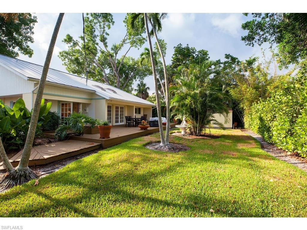 641 Palm Circle West Naples, FL 34102 - Photo 2 of 13 a view of swimming pool with lawn chairs and plants