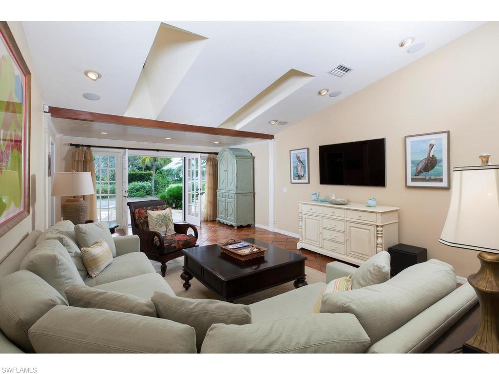 641 Palm Circle West Naples, FL 34102 - Photo 3 of 13 a living room with furniture and a flat screen tv