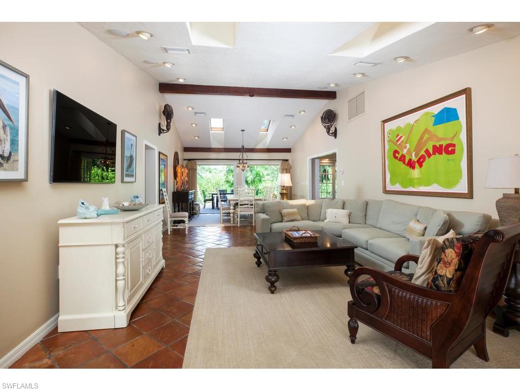 641 Palm Circle West Naples, FL 34102 - Photo 4 of 13 a living room with furniture and a flat screen tv