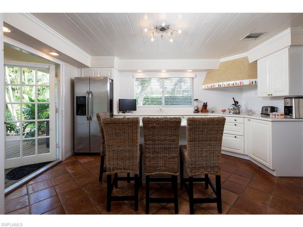 641 Palm Circle West Naples, FL 34102 - Photo 6 of 13 a view of a dining room with furniture window and outside view