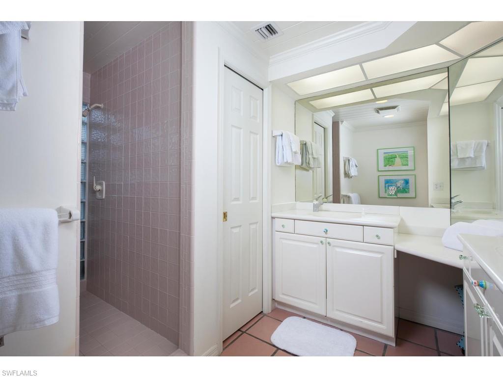 641 Palm Circle West Naples, FL 34102 - Photo 9 of 13 a kitchen with a sink and cabinets