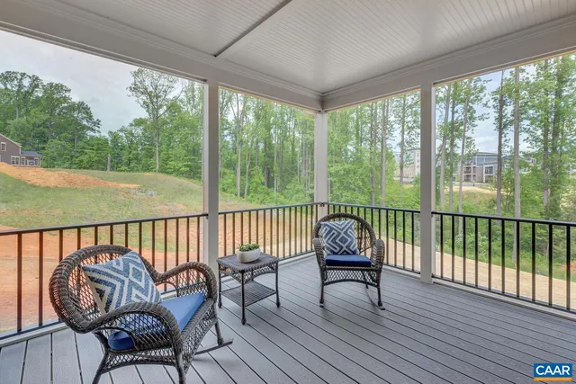 a view of a two chairs in the balcony