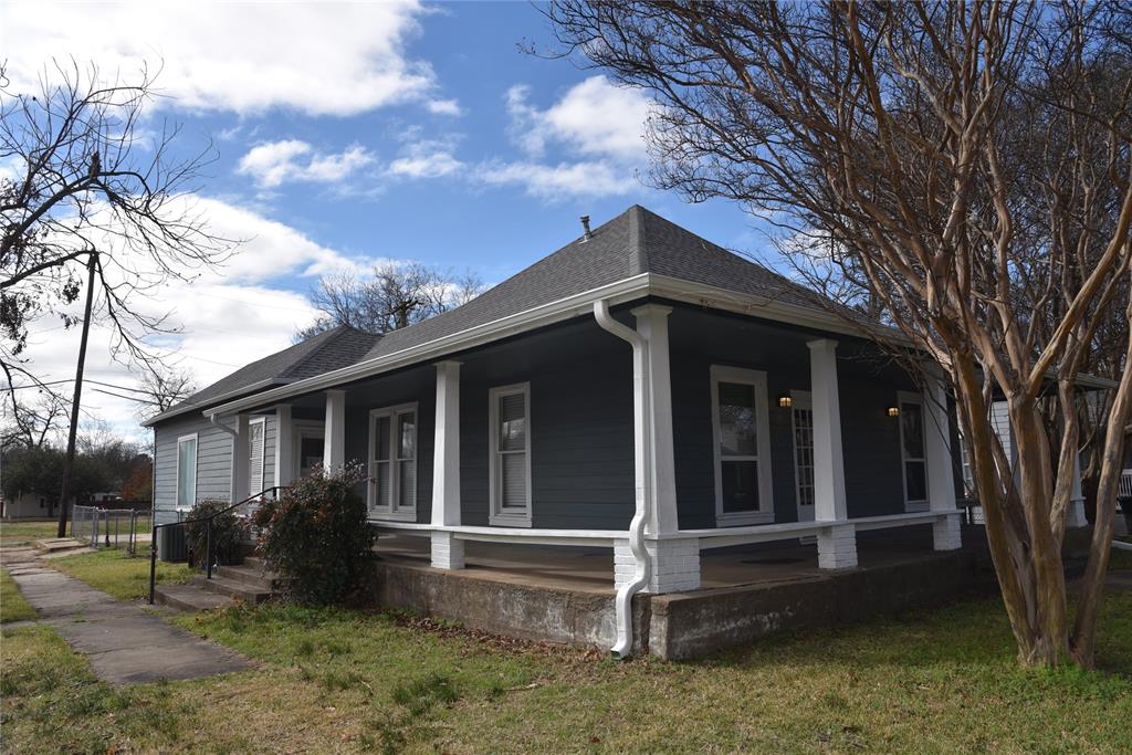 900 West Chestnut Street Denison, TX 75020 - Photo 2 of 22 a view of house with a yard