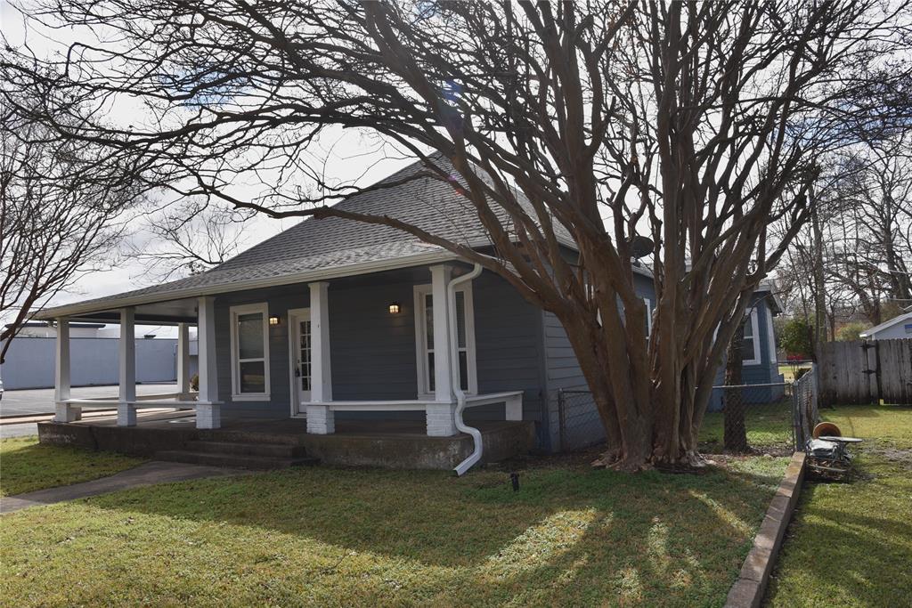 900 West Chestnut Street Denison, TX 75020 - Photo 3 of 22 a view of a house with a yard